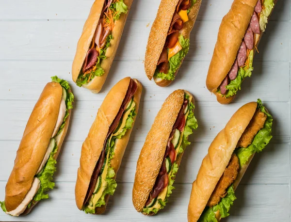 Fresh sub sandwich on white and wheat hoagies. — Stock Photo, Image