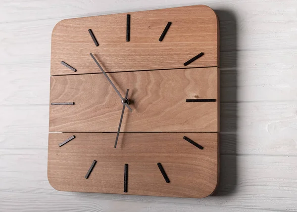 Beautiful Wall Clock Made of Wood on Wood Background