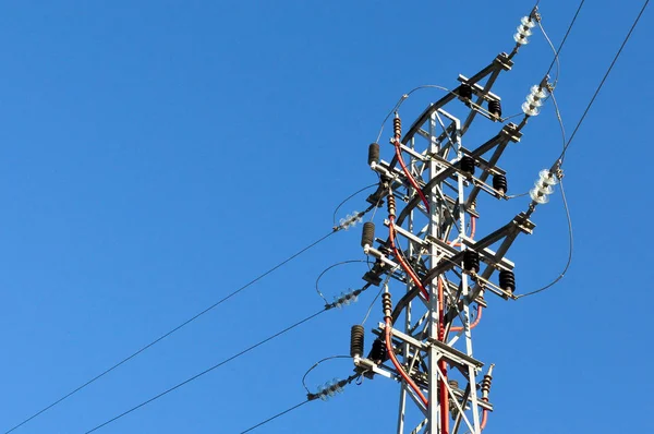 electric grid tower and blue sky