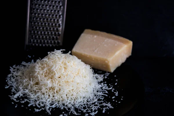 Hand Grated Parmesan Cheese Black Plate — Stock Photo, Image
