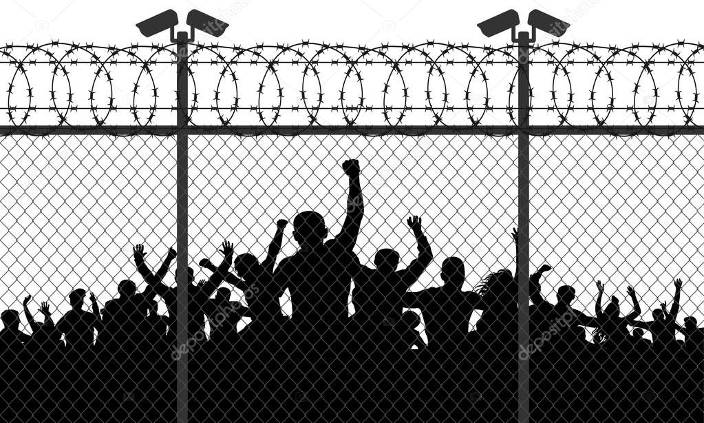 Enraged crowd of people are behind bars. Fence wire mesh barbed wire, vector silhouette. Street camera on the pillar