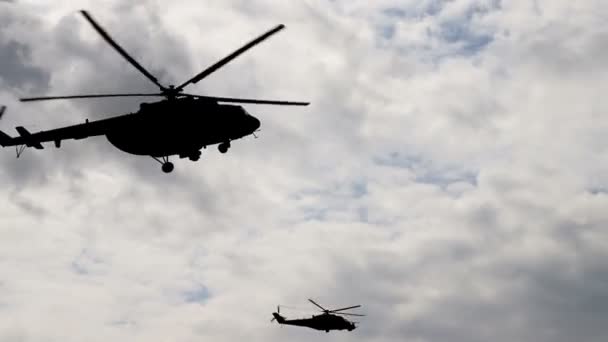 Helicopter (silhouette) flies in the sky close up. — Stock Video