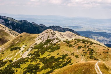 Kotlowa Czuba, rocky Zadni Ornak peak on Ornak mountain ridge and Kominiarski Wierch mountain ridge on the background in Western Tatras mountains in Poland from Gaborowa Przelecz pass clipart