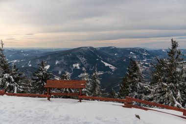 Radhost, Knehyne, Smrk and many other hills  from Lysa hora hill in winter Moravskoslezske Beskydy mountains in Czech republic clipart