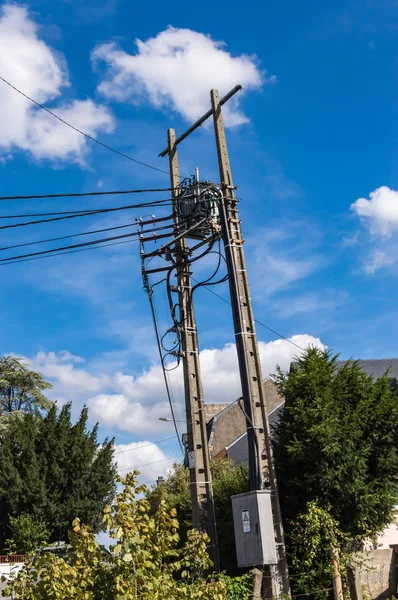 Power line concrete pole end with cables falling vertically. Pow