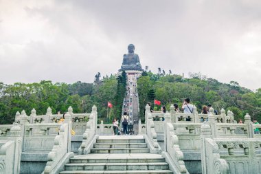HONG KONG - 30 OCT 2018: Tian Tan Giant Buddha (aka the Big Buddha) situated on Ngong Ping plateau The place is one of the most popular tourist destination in Lantau Island, Hong Kong clipart