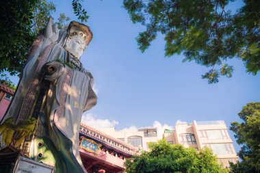 HONG KONG - NOV 8,2018:Large white Guan Yin goddess statue the famous place for tourist located at the Repulse Bay is a quaint Taoist temple which is popular for its colorful mosaic statues clipart