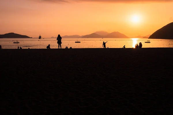 Silhouette of People on Sunset Beach at Repulse bay hong kong