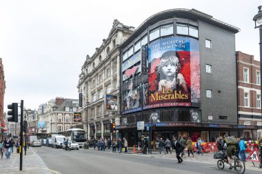London, UK - April 2018: Queens Theatre, West End theatre located in Shaftesbury Avenue on the corner of Wardour Street in City of Westminster performing several notable productions since 1907 including the current production of Les Miserables clipart