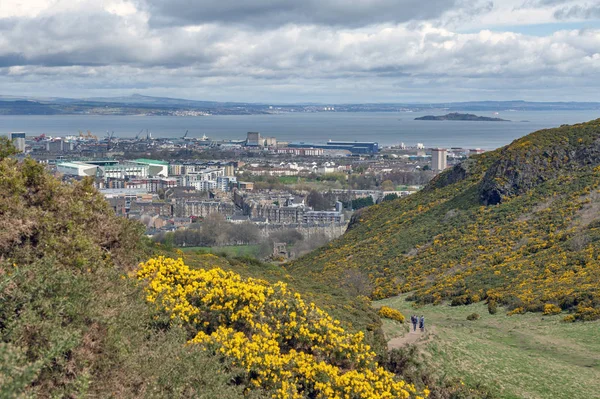 View of Edinburgh city towards coastal area of the North Sea from Arthur Seat, the highest point in Edinburgh located at Holyrood Park, Scotland, UK