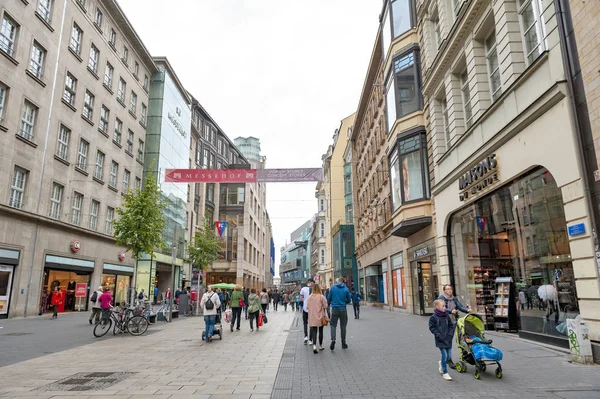 Leipzig, Germany - October 2018: Pedestrians on street alongside with old buildings in central business district and city square near Augustusplatz in downtown Leipzig, Germany — Stock Photo, Image