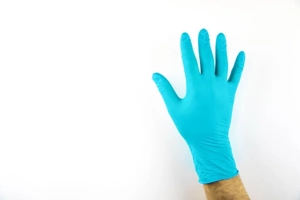 Male hand in medical glove on white background. — Stock Photo, Image