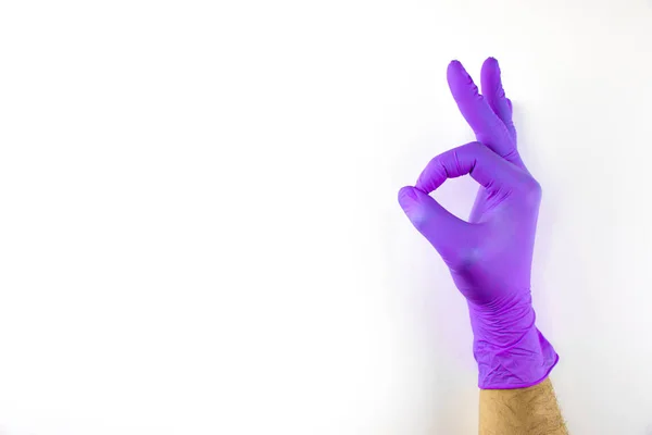 Male hand in medical glove on white background. — Stock Photo, Image