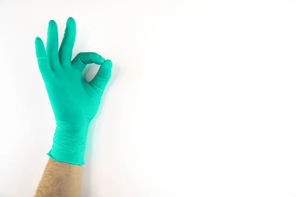 Male hand in medical glove on white background. — Stock Photo, Image