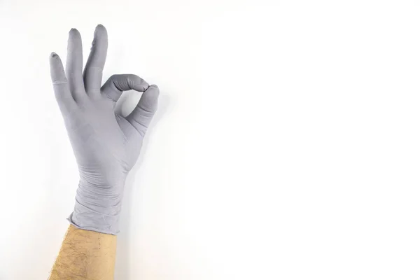 Mão masculina em luva médica no fundo branco . — Fotografia de Stock