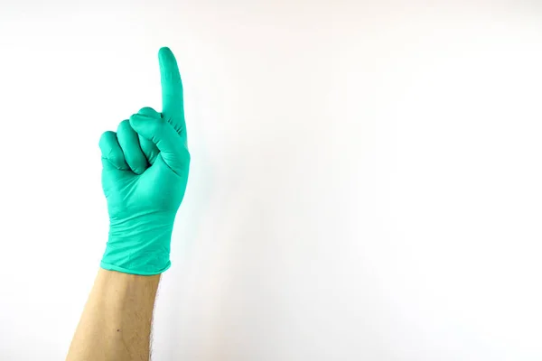 Mano masculina en guante médico sobre fondo blanco . —  Fotos de Stock