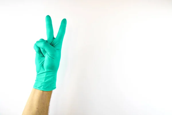 Male hand in medical glove on white background. — Stock Photo, Image