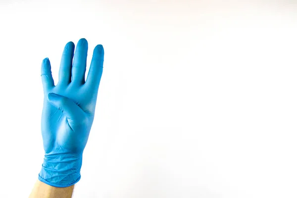 Männliche Hand in medizinischem Handschuh auf weißem Hintergrund. — Stockfoto