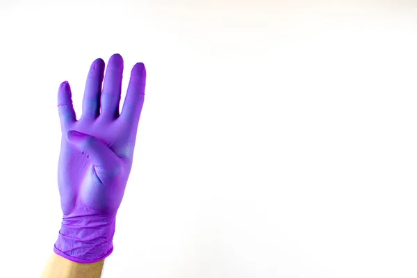 Male hand in medical glove on white background. — Stock Photo, Image