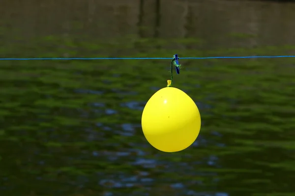 Fence Hangs Small Balloon — Stock Photo, Image