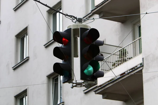 the traffic light hanging at the crossroads