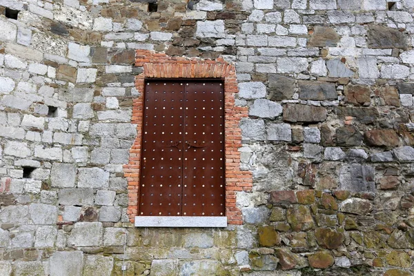 Door - an opening in the wall for entering and leaving the room