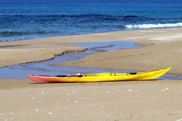 sports kayak on the shores of the Mediterranean Sea in the north of Israel