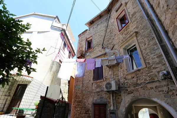 on the balcony, laundry is washed, and where do you dry your laundry?