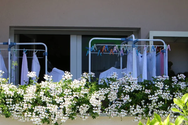 on the balcony, laundry is washed, and where do you dry your laundry?