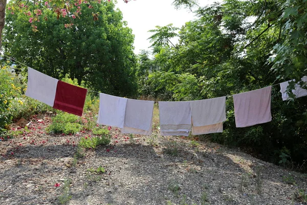 on the balcony, laundry is washed, and where do you dry your laundry?