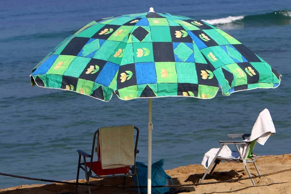 umbrella - a device designed to protect people from rain or from sunlight.