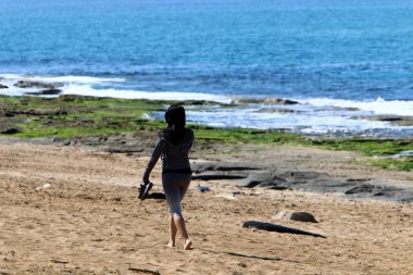 Kumdaki Akdeniz kıyısında 