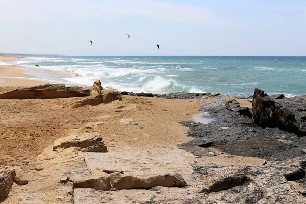 kiteboarding - riding the waves in the Mediterranean on special light boards and wings