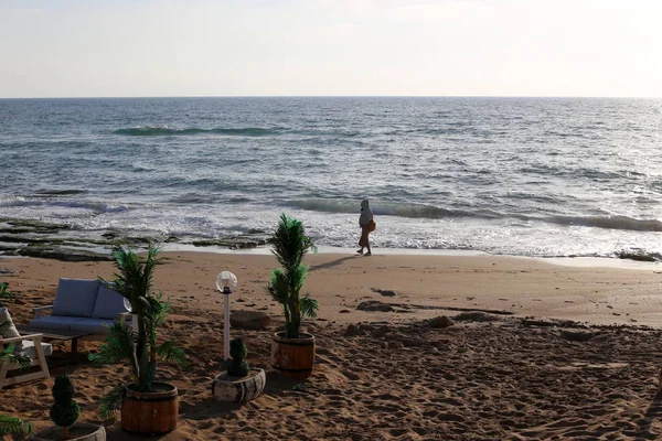 Stock image man resting on the shores of the Mediterranean Sea in northern Israel 