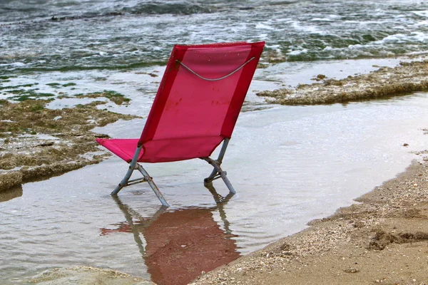 lounge chair on the shores of the Mediterranean in the north of Israel