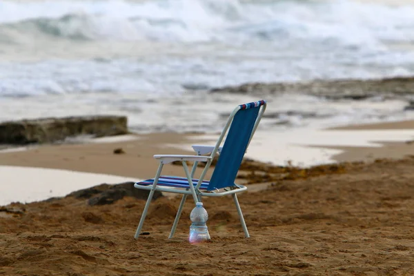 lounge chair on the shores of the Mediterranean in the north of Israel