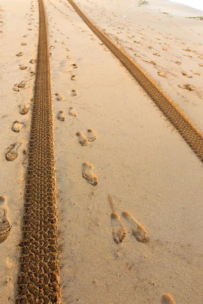 footprints in the sand on the shores of the Mediterranean in the north of the state of Israel