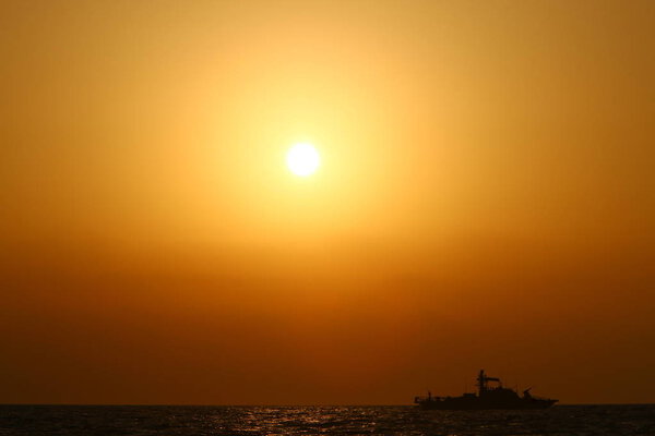 The sun sets over the horizon on the shores of the Mediterranean Sea in the north of the State of Israel. 