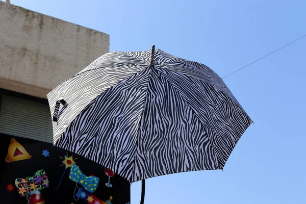 parasol and rain in the city park