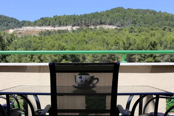 chair and table standing in a cafe on the shores of the Mediterranean in Israel