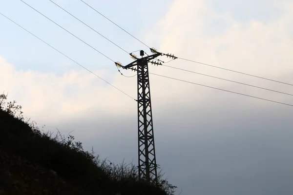 electrical wires on a pole along which electricity flows in the north of Israel