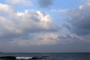thunderclouds and clouds float across the sky above the Mediterranean Sea in the north of Israel  clipart