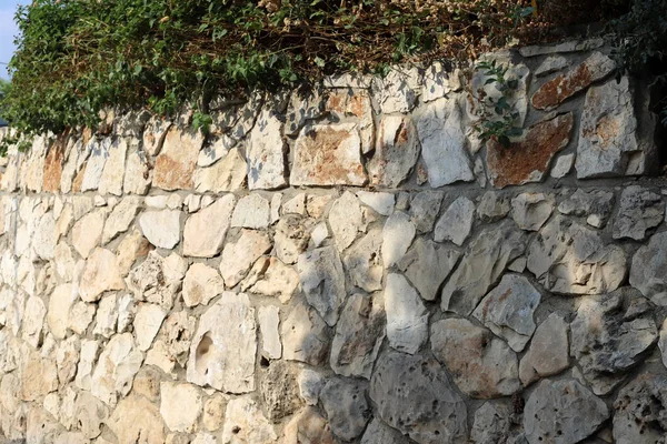 high stone and concrete wall built in the north of Israel
