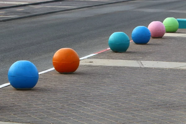 Multi Colored Concrete Balls Lie Sidewalk City Serve Barrier Carriageway — Stock Photo, Image