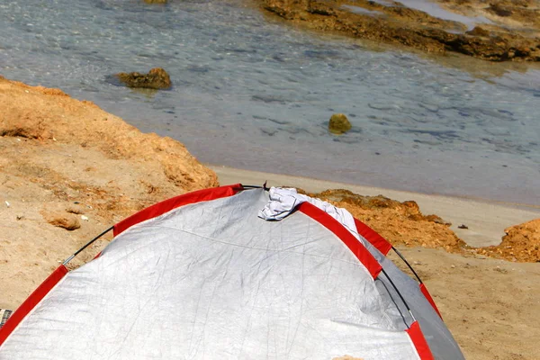 camping tent on the deserted coast of the Mediterranean Sea in the north of Israel