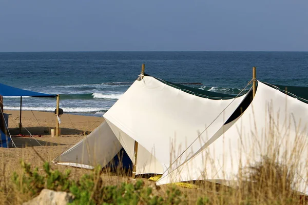 camping tent on the deserted coast of the Mediterranean Sea in the north of Israel