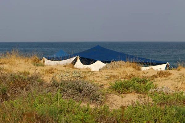 camping tent on the deserted coast of the Mediterranean Sea in the north of Israel