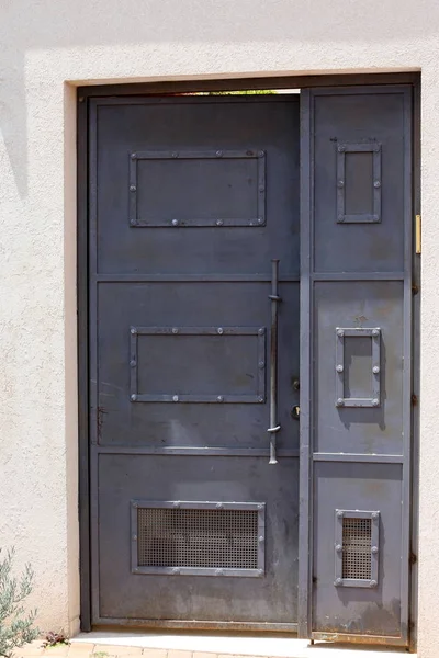 Door - an opening in the wall for entering and exiting a building, premises, or an opening into the interior