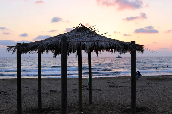 canopy for protection from the hot sun on the shores of the Mediterranean Sea in the north of Israel