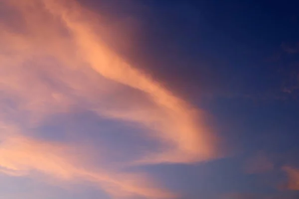 Fiery red sky lighting over the horizon at sunset. The sun sets over the horizon in the Mediterranean Sea in northern Israel